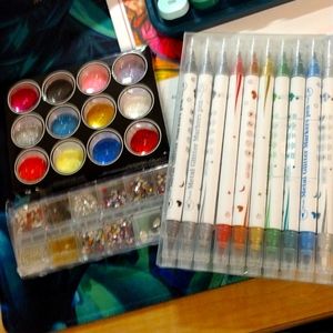 Nail art glitters, pens and gems